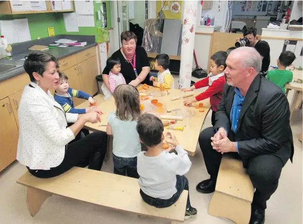  ?? — ADAM FOSTER FILES ?? NDP leader John Horgan and MLA Melanie Mark at the Terry Tayler Centre in Vancouver in 2016. Horgan said on Tuesday the province will introduce a new child care plan, which will be phased in over 10 years.