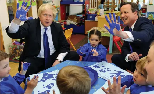  ??  ?? Hands up if you’re a blue! Boris Johnson and David Cameron getting their hands dirty on the campaign trail yesterday