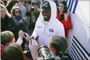  ?? JOHN BAZEMORE — THE ASSOCIATED PRESS ?? Georgia linebacker Nakobe Dean is greeted by a large crowd of fans as he and his teammates return to the Georgia campus, Tuesday, Jan. 11, 2022, in Athens, Ga.