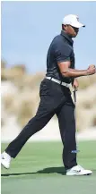  ??  ?? Tiger Woods is pumped on the fourth hole Thursday in Nassau, Bahamas.