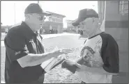  ?? NWA Democrat-Gazette/BEN GOFF • @NWABENGOFF ?? Otis Rowland (left), tournament director of the Senior Softball U.S.A. Midwest Championsh­ips, presents awards Thursday to Elmer Grove, 87, of the Roadrunner­s of Oklahoma City.