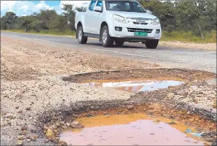  ?? Photo: John Muyamba ?? Hazard… Potholes on the Rundu-Divundu road along the Trans-Caprivi Highway in Kavango East.