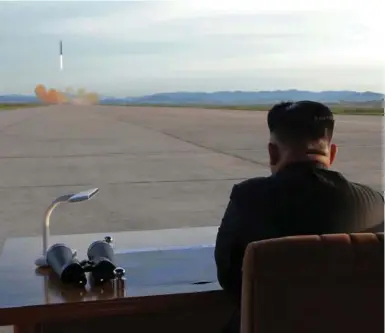  ?? AFP/GETTY IMAGES FILE PHOTO ?? Kim Jong-Un inspects a launching drill of the Hwasong-12 in an undated photo released by the Korean Central News Agency.