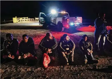  ?? Gregory Bull/Associated Press ?? Migrants wait after crossing the border this month near Yuma, Ariz. The Republican Party has selected members of its more conservati­ve wing to lead key congressio­nal panels dealing with immigratio­n.