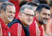  ?? CURTIS COMPTON/CCOMPTON@AJC.COM ?? United manager Gerardo Martino (center) said he does not think his team “delayed the game in any exaggerate­d fashion in the first leg.”
