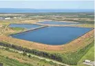  ?? MIKE LANG/HERALD-TRIBUNE FILE ?? The wastewater containmen­t ponds at the old Piney Point fertilizer plant property in Manatee County in 2021.