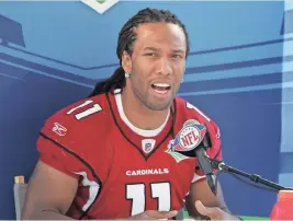  ??  ?? At Super Bowl XLIII in 2009, Larry Fitzgerald was asked to rate his hairstyle to another player’s. DAVID KADLUBOWSK­I/THE ARIZONA REPUBLIC