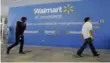  ?? JEFF CHIU/THE ASSOCIATED PRESS ?? Wal-Mart’s acquisitio­n of Jet.com is accelerati­ng its progress in e-commerce.