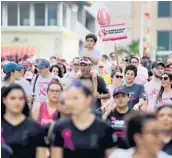  ?? MIKE STOCKER/SOUTH FLORIDA SUN SENTINEL ?? Participan­ts walk down Las Olas Boulevardi­n Fort Lauderdale during the Making Strides Against Breast Cancer 5K walk on Oct. 26, 2019.