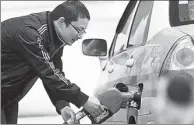  ?? HU GUOLIN / FOR CHINA DAILY ?? A driver fuels his car at a gas station in Jiangxi province. Oil prices have been rising recently.