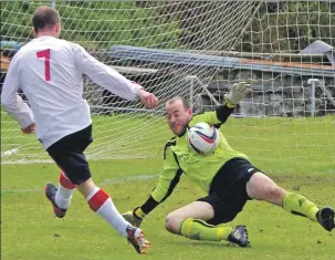 ??  ?? Port Glasgow goalkeeper Stuart Burns saves from Ross Maitland.