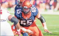  ?? Bradley Leeb / Associated Press ?? Illinois offensive lineman Doug Kramer (65) blocks during a 2017 game against Rutgers in Champaign, Ill. For a program that has not had a winning record since 2011 and has reached the postseason just twice in that time, the hope is that Alex Palczewski, fellow linemen Kramer and Vederian Lowe and the super class will power a long awaited breakthrou­gh in Champaign.