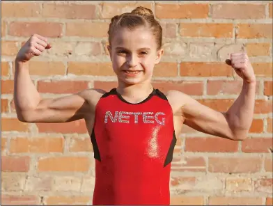  ?? Terrance Armstard/News-Times ?? Mighty Might: El Dorado's Anabelle Dewey, 9-year-old daughter of Eric and Christy Dewey, currently competes at North East Texas Elite Gymnastics. She will compete next week at the TOPS A National Team in Houston and hopes to, one day, become an Olympian.