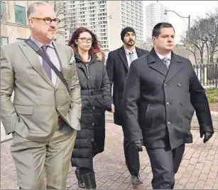  ?? CP PHOTO ?? Const. James Forcillo, right, arrives for his verdict at court in Toronto on Monday. A Toronto jury found Forcillo guilty of attempted murder in the 2013 shooting death of a teen on an empty streetcar.