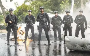  ?? Jordin Althaus / Associated Press ?? This image released by CBS shows, Jay Harrington, from left, David Lim, Shemar Moore, Kenneth Johnson, Lina Esco and Alex Russell in a scene from the series
“S. W. A. T.” The May 25 killing of George Floyd at the hands of Minneapoli­s police has set off protests worldwide and transmitte­d images of law enforcemen­t that long remained far outside the narratives of crime stories.