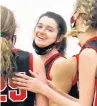  ?? JOHN SMIERCIAK / DAILY SOUTHTOWN ?? Caitlyn Rochon, center, is all smiles after Lincoln-Way Central beat Lincoln-Way East in the semifinals of the Sandburg Tournament on Tuesday.