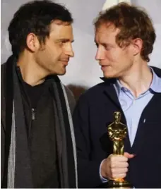  ?? REUTERS ?? Laszlo Nemes, right, directed the Oscar-winning Son of Saul, starring Geza Rohrig, left, as Hungarian Jew in the Auschwitz death camp.