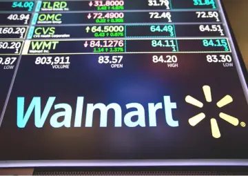  ??  ?? The Walmart logo on the floor of the New York Stock Exchange.