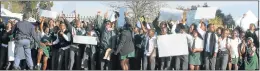  ?? Picture: BHONGO JACOB ?? IN THE DARK: Maria Louw High School pupils march to the district office after the power cuts