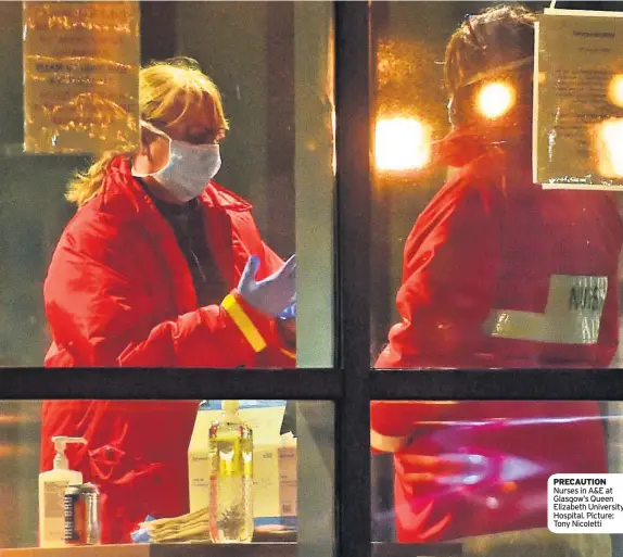  ??  ?? PRECAUTION Nurses in A&E at Glasgow’s Queen Elizabeth University Hospital. Picture: Tony Nicoletti