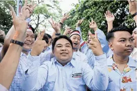  ?? /Reuters ?? First round: Supporters of Indonesian defence minister and presidenti­al candidate Prabowo Subianto outside his home in the capital, Jakarta, on Wednesday.