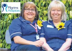  ??  ?? Above, from left, nurses Sarah Brown and Mary Honey wear their sunflowers and, right, Alison Wiltshire