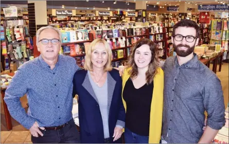  ?? STEVE MacNAULL/The Daily Courier ?? Mosaic Books in downtown Kelowna is a family affair. Michael and Michele Neill and their children, Alicia and Trevor, all work at the store at 411 Bernard Ave.