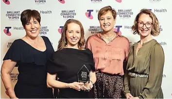  ?? ?? Dr Natalie Thorne was well supported by her colleagues as she was presented with her award. From left: Melbourne Genomics executive director Professor Clara Gaff, Dr Natalie Thorne, Senior Project Manager in Digital Health Keeley Reed and Lead Business Analyst in Genomics and Digital Health Kitty O’Brien.