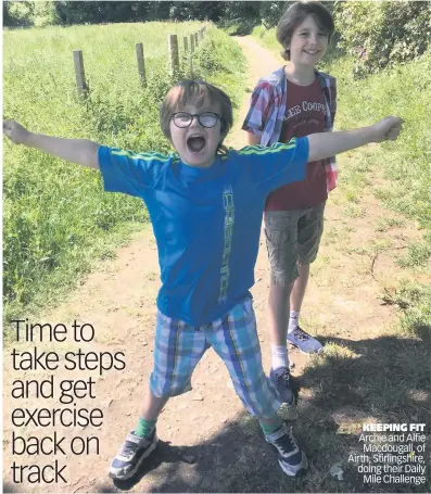  ??  ?? KEEPING FIT Archie and Alfie Macdougall, of Airth, Stirlingsh­ire, doing their Daily Mile Challenge