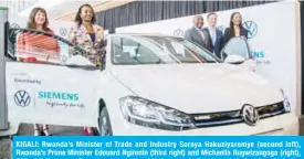  ??  ?? KIGALI: Rwanda’s Minister of Trade and Industry Soraya Hakuziyare­mye (second left), Rwanda’s Prime Minister Edouard Ngirente (third right) and Michaella Rugwizango­ga (right), CEO of Volkswagen Rwanda, pose aside of Volkswagen’s first imported electric vehicle “eGolf” during its launching ceremony in Kigali, Rwanda, on Tuesday. — AFP