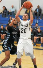  ?? GENE WALSH — DIGITAL FIRST MEDIA ?? Upper Merion’s Ethan Miller goes to the basket.