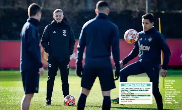  ?? — AFP ?? Man United coach Ole Gunnar Solskjaer (second left) during a training session at the Carrington Training complex on Monday.