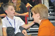  ??  ?? Gary Findlay, 12, having a post-meeting chat with First Minister Nicola Sturgeon.