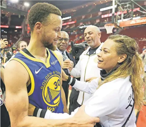  ?? THOMAS B. SHEA/USA TODAY SPORTS ?? Stephen Curry hugs his mother, Sonya Curry, as his father, Dell, looks on Friday after the Warriors won the Western Conference semifinals series against the Rockets.