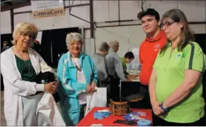  ??  ?? From left, Linda Matthew and Betty Lercher learn about emergency care from NorthStar EMS staff members Samuel Pike and Danna Short.