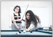  ?? NWA Democrat-Gazette/CHARLIE KAIJO ?? Diana Duran of Springdale shoots pool Nov. 21 at the Northwest Arkansas Community College’s game room in Bentonvill­e. The college continues to study adding dormitorie­s to its campus. The college is investing about $10,000 in a study by Vogt Strategic Insights.