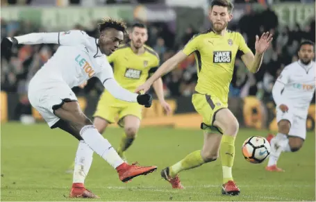  ??  ?? Two-goal striker Tammy Abraham fires in a shot for Swansea in last night’s 8-1 FA Cup mauling of League Two club Notts County.