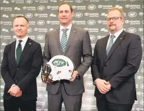  ?? Seth Wenig / Associated Press ?? Jets coach Adam Gase, center, poses with team owner Christophe­r Johnson, left, and general manager Mike Maccagnan. Maccagnan was recently fired by the team.