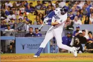  ?? Mark J. Terrill / Associated Press ?? The Los Angeles Dodgers’ Joey Gallo hits a three-run home run during the seventh inning against the Minnesota Twins on Wednesday in Los Angeles.