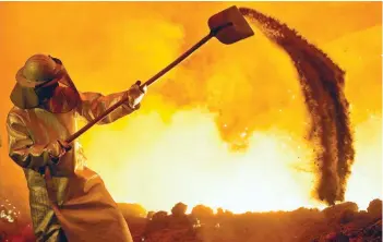  ?? — Reuters ?? A steelworke­r is pictured at a furnace at the plant of German steel company in Salzgitter, Lower Saxony, Germany.