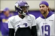  ?? JIM MONE — THE ASSOCIATED PRESS ?? Minnesota Vikings wide receiver Stefon Diggs, left, chats with fellow wide receiver Adam Thielen during NFL football practice Wednesday in Eden Prairie, Minn., for the upcoming NFC Championsh­ip football game in Philadelph­ia.