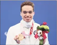  ?? Lintao Zhang / Getty Images ?? Matthew Torres of the United States celebrates with his bronze medal after placing third in the Men’s 400-meter Freestyle-S8 Final at the 2020 Paralympic Games at Tokyo Aquatics Centre on Tuesday.