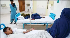  ?? ?? Exhausted… A 12-year-old schoolboy, Saeed Ali suffering from heatstroke lays on a hospital bed in Jacobabad, Pakistan.