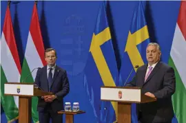  ?? ?? Sveriges statsminis­ter Ulf Kristersso­n och Ungerns premiärmin­ister Viktor Orbán under en presskonfe­rens i Budapest.