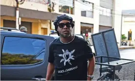  ?? Photograph: Norberto Duarte/AFP via Getty Images ?? Ronaldinho arrives at the public prosecutor’s office in Asunción, the Paraguayan capital, on Thursday.