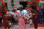  ?? BRUNA PRADO — THE ASSOCIATED PRESS ?? Carnival King Momo, Djferson Mendes da Silva, holds the key to the city during the official start of Carnival in Rio de Janeiro, Brazil, on Friday.