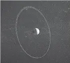  ?? PROVIDED ?? An artist’s impression of the dwarf planet Quaoar and its ring. Quaoar’s moon Weywot is at left.