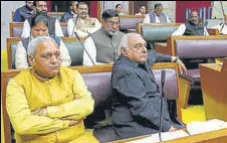  ?? KESHAV SINGH/HT ?? Leader of opposition Bhupinder Singh Hooda with other Congress legislator­s in the Haryana assembly on Tuesday; and (right) chief minister Manohar Lal Khattar speaking in the House as deputy chief minister Dushyant Chautala looks on.