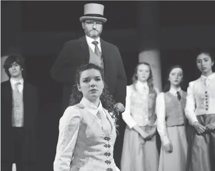  ?? HEATHER LOUNDER ?? Sophia Swettenham, front, stars as the strong-willed Tess Moffat, a young woman thrown headfirst into a world of discrimina­tion, prejudice and forbidden love as she pursues a university education in the late 1800s, in Elmwood School’s production of...