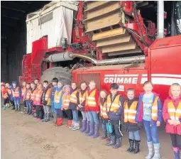  ??  ?? Field trip Youngsters at Drumness Farm near Auchterard­er